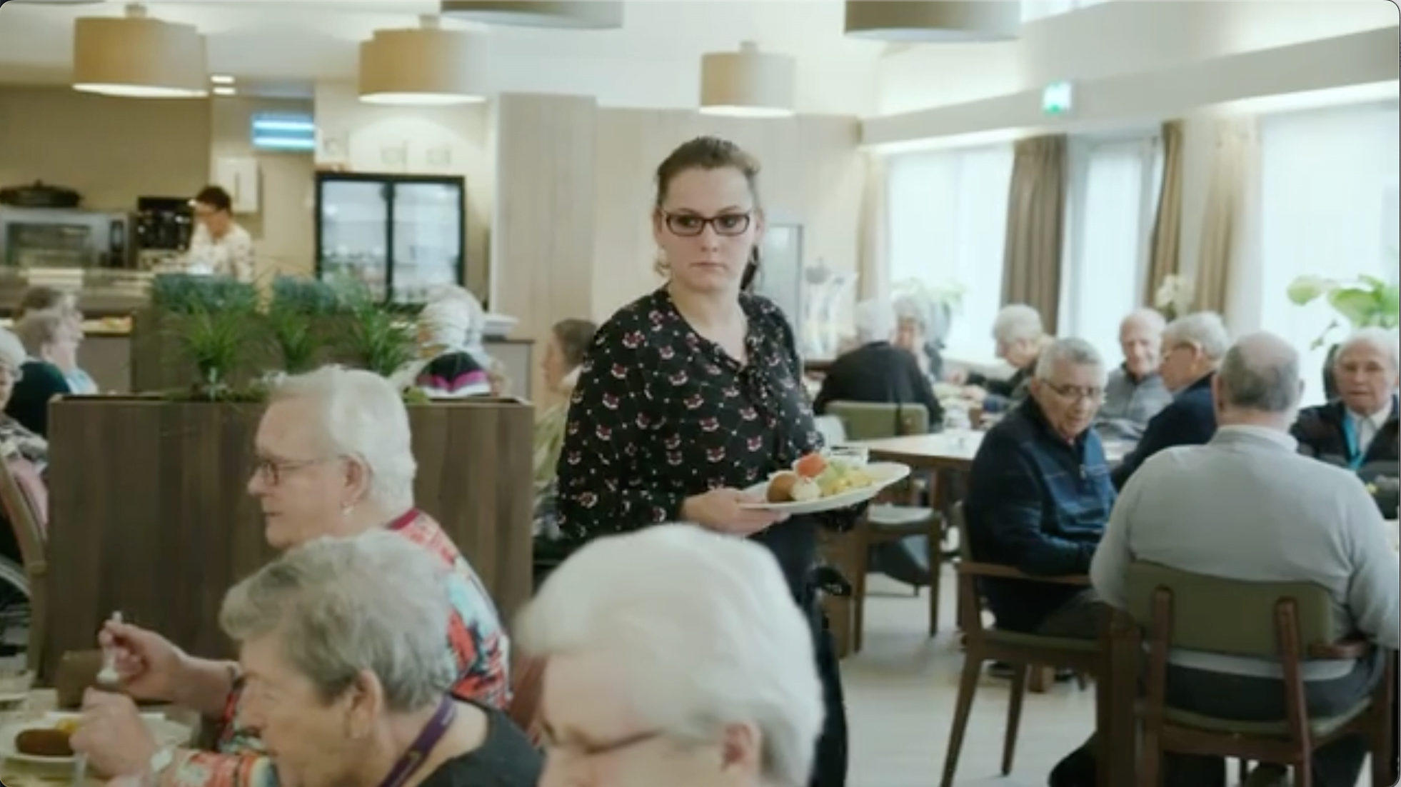 A person holds a plate of food.