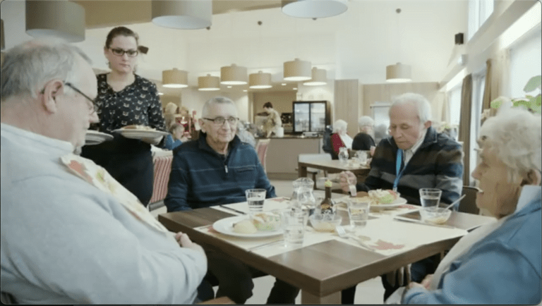 A group is gathered around a table.